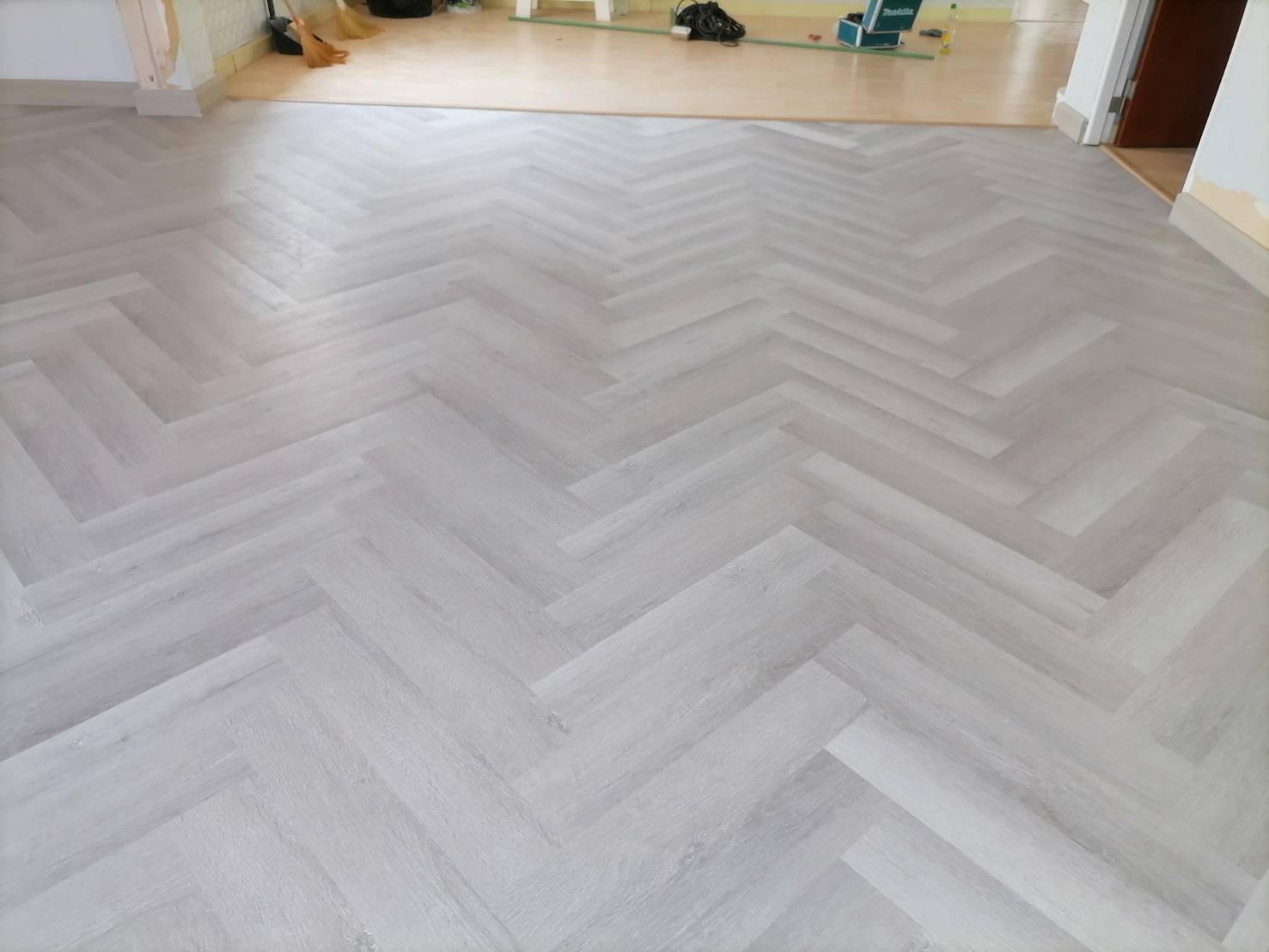 SPC Flooring Collection 4 mm.125x625 - Dessert Grey Herringbone product_closeup_image